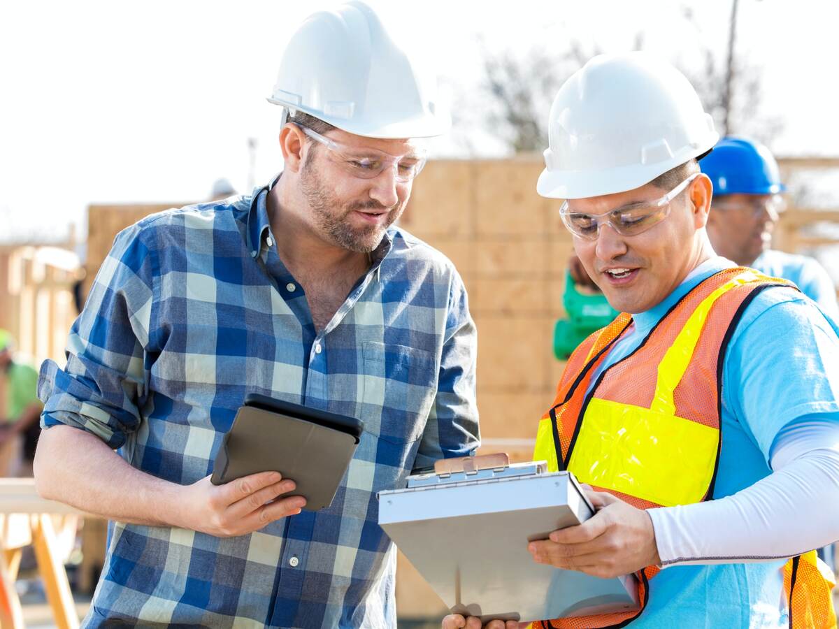 Construction managers discuss building plans